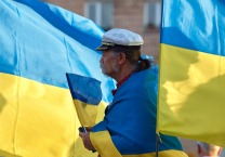 Old man with Ukrainian flags